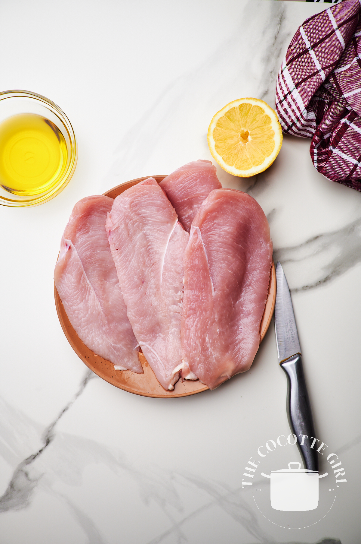 sliced chicken breast in half lengthwise